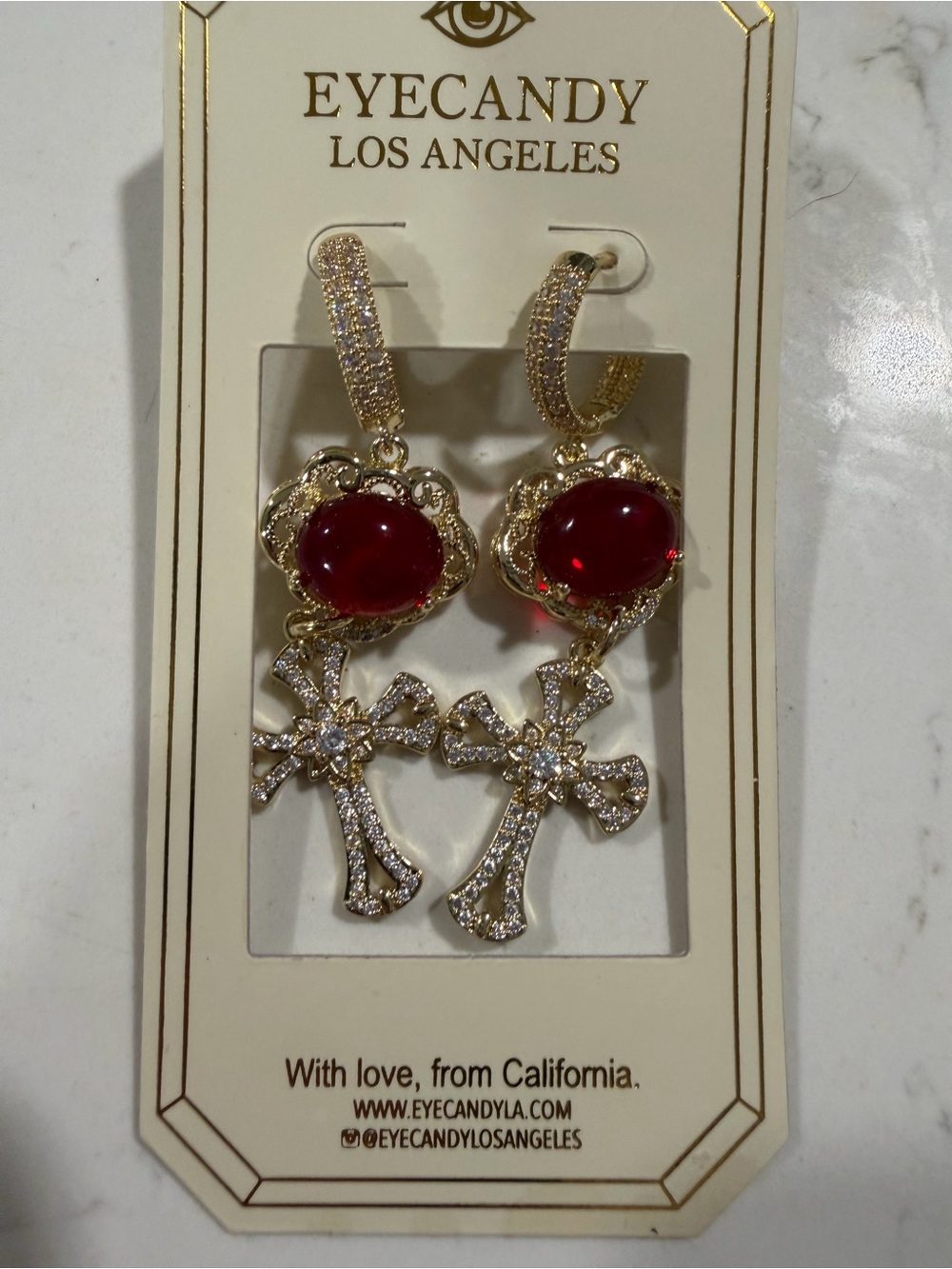 eye candy Gold Cross Drop Earrings with Red Cabochon